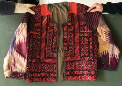 A SHORT COTTON JACKET, made up with embroidered panels, approx. 44in chest x 24in long.