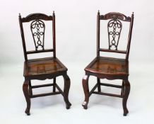 A GOOD PAIR OF CHINESE ROSEWOOD SIDE CHAIRS, the cresting rail carved with a bat and scrolls above a
