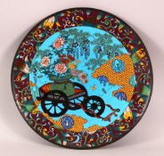 A JAPANESE MEIJI PERIOD CLOISONNE DISH - decorated with a blue ground depicting native display if