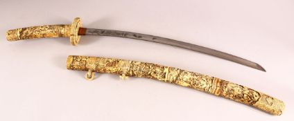 A LARGE JAPANESE MEIJI PERIOD CARVED SECTIONAL IVORY KATANA - carved in relief depicting many