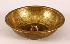 A 19TH CENTURY PERSIAN QAJAR BRASS CALLIGRAPHIC MAGIC BOWL, 15cm diameter.