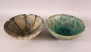 TWO 12TH/13TH CENTURY PERSIAN SELJUK POTTERY BOWLS, both 20cm diameter.