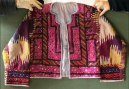 A GOOD ETHNIC MIRRORED JACKET, European, made up of Kutch and Uzbek antique pieces of geometric