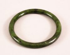 A CHINESE CARVED JADE BANGLE, 7.5cm