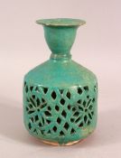A KASHAN GLAZED TERRACOTTA WATER SPRINKLER, the body with openwork decoration, 15.5cm high,