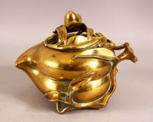 AN UNUSUAL CHINESE PEACH FORMED BRONZE CENSER, the body formed as a peach, stood upon tripod legs