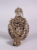 A CHINESE WHITE METAL OPENWORK SNUFF BOTTLE, with decoration in openwork and depicting immortal
