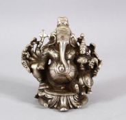A FINE 18TH/19TH CENTURY SOUTH INDIAN WHITE METAL FIGURE OF GANESHA, 9cm high.