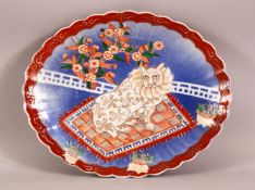 A JAPANESE MEIJI PERIOD IMARI PORCELAIN CAT DISH - the dish with raised cat decoration upon a rug