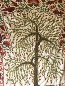 A GOOD UZBEK PRAYER ARCH, 'Tree of Life', 20th Century, green embroidered tree surrounded by a red