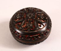 A SMALL 20TH CENTURY CHINESE CINNABAR STYLE CYLINDRICAL LIDDED BOX - 6.5CM