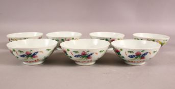 A SET OF SEVEN 19TH CENTURY CHINIESE FAMILLE ROSE PORCELAIN BOWLS - each decorated with flowers