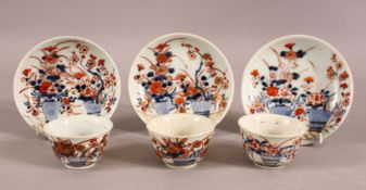 A MIXED LOT OF THREE CHINESE IMARI TEA BOWLS & SAUCERS - Each decorated in similar style with flora