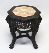 A CHINESE CARVED HARDWOOD AND MARBLE INSET OCTAGONAL SHAPED STAND, the frieze carved and pierced