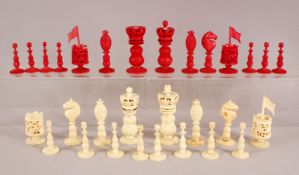A BOX OF CHINESE FINELY CARVED IVORY CHESS PIECES, the largest piece 10cm high, the smallest 5.5cm.