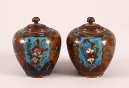A SMALL PAIR OF CLOISONNE KORO AND COVERS, the bodies decorated insects, flowers and birds, 8cm