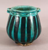 A SMALL RAQQA WARE POSSIBLY 14TH CENTURY TURQUOISE POT, 10cm high, approx. 10cm diameter.