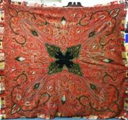 A GOOD LARGE INDIAN PAISLEY SHAWL, hand stitched with central black ground panel surrounded by