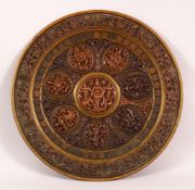 A FINE 19TH CENTURY SOUTH INDIAN TANJORE COPPER INLAID BRASS CHARGER depicting Hindu gods, 31cm