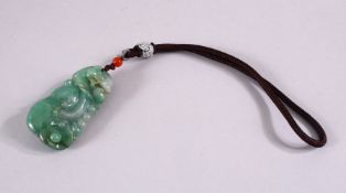 A SMALL CHINESE CARVED JADEITE PENDANT on string, pendant 6cm x 3cm.