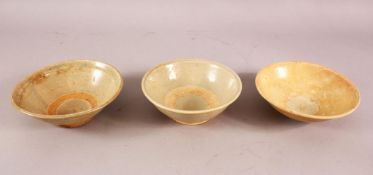 THREE EARLY CHINESE POTTERY BOWLS, of varying style and size (3)