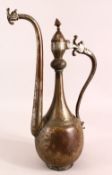 AN ISLAMIC SAFAVID TINNED COPPER EWER, the body with engraved decoration, the handle and spout