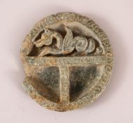 A GANDHARA ENGRAVED STONE SECTIONAL DISH, one section carved as a dragon, 11.5cm diameter.