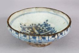 AN EARLY PERSIAN TIMURID BLUE AND WHITE GLAZED POTTERY BOWL, 19cm diameter.