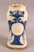 A GLAZED POTTERY BLUE AND WHITE MEDICINE JAR, the body decorated with emblem depicting birds and