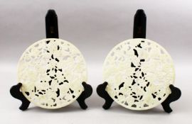 TWO 20TH CENTURY CHINESE CARVED HARDSTONE / JADELIKE BI - DISKS, each disk carved with koi carp