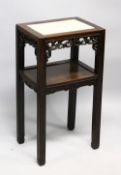 A GOOD LATE 19TH CENTURY CHINESE HARDWOOD TWO TIER STAND, the top inset with a marble panel above