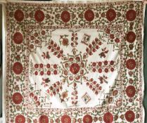 A SUSANI WEDDING DOWRY, 20th Century, with red and green silk floral embroidery on a beige cotton