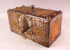 A FINE NORTH AFRICAN TUAREG STEEL, COPPER AND BRASS BOUND WOODEN CASKET, with pierced and