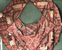AN EARLY EMBROIDERED PONCHO OR SHAWL, later converted to pouffe cover, approx 4ft 9in x 4ft 3in.