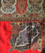A EUROPEAN RED SILK SQUARE PAISLEY SHAWL, part mid 19th Century with later tassel and corner