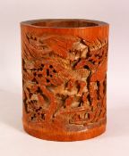 A GOOD CHINESE CARVED BAMBOO BRUSH POT - carved with scenes of landscapes and figures, 18cm high x