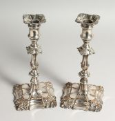 A PAIR OF 19TH CENTURY SHEFFIELD PLATE CANDLESTICKS of Georgian design. 9ins high