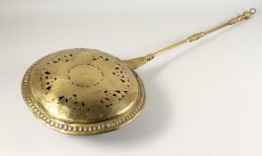 A QUEEN ANN BRASS WARMING PAN with brass handles