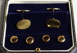 A GOLD-PLATED DRESS SET, comprising a pair of cufflinks and four studs.