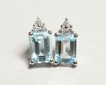 A PAIR OF 18CT WHITE GOLD AQUAMARINE AND DIAMONDS EARRINGS, the rectangular cut aquamarine approx.