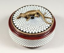 A CONTINENTAL PORCELAIN CIRCULAR BOX AND COVER, the top with a lizard. 5 ins diameter.
