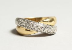 AN 18CT GOLD DIAMOND SET CROSS OVER RING