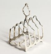 A FOUR DIVISION SILVER TOAST RACK Sheffield 1908