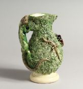 A PALISSY WARE TYPE JUG, with lizard handle and moulded decoration