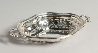 A TWO HANDLED SILVER PIERCED BON-BON DISH 7ins long Birmingham 1917