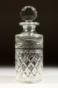 A CIRCULAR EDINBURGH GLASS DECANTER AND STOPPER.