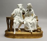 A SUPERB SEVRES WHITE BISQUE PORCELAIN AND ORMOLU GROUP, two figures sitting on an ormolu bench,
