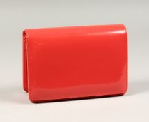 A HOBBS CORAL PATENT HANDBAG