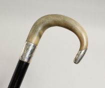 A SILVER MOUNTED WALKING STICK, late 19th / early 20th Century, the handle rhino horn