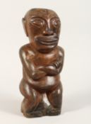 A CARVED WOOD POLYNESIAN FIGURE 18ins high